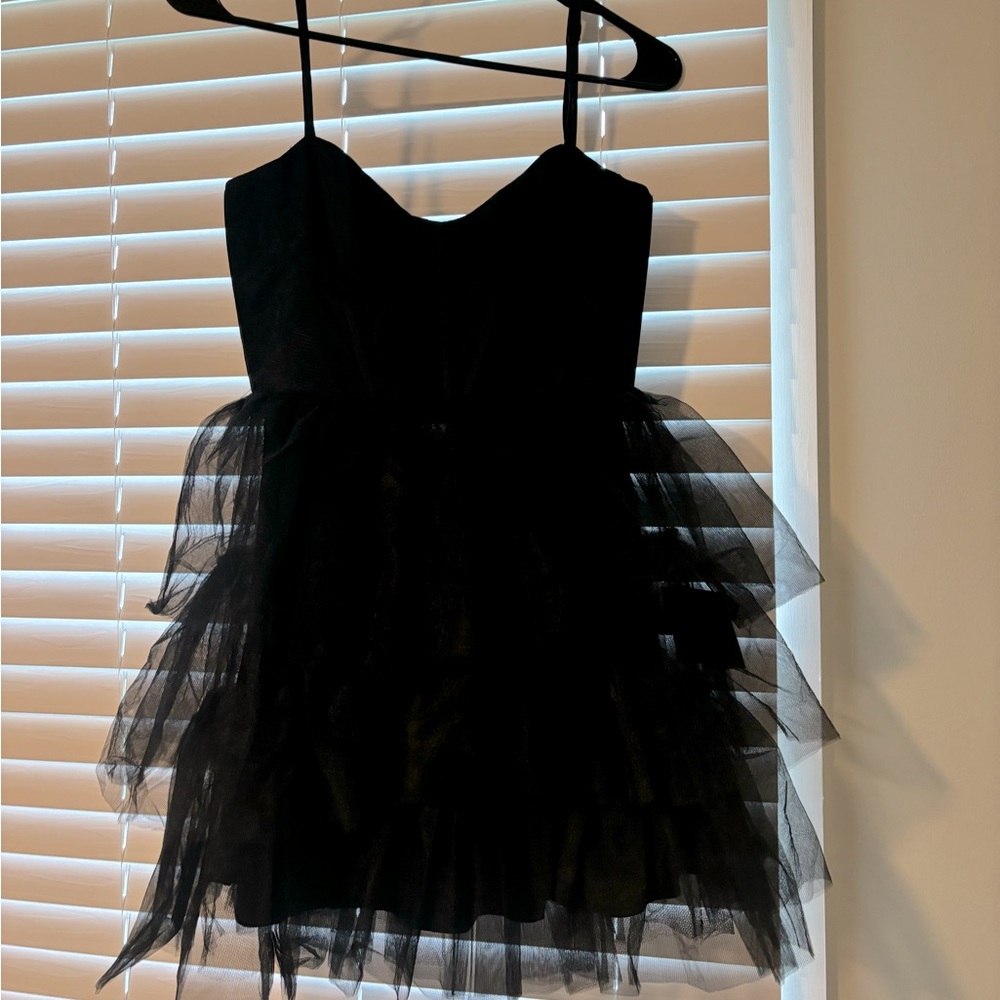 Lulus Black Run the runway dress with tags on it.